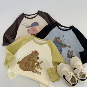 Flat lay of cotton raglan long sleeve t-shirts with cute cartoon animal illustrations