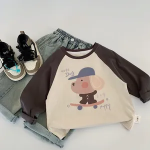 Flat lay of kids' raglan sleeve t-shirt with cute dog print and denim jeans outfit