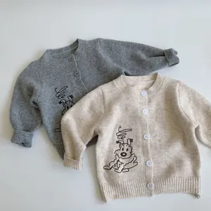 Detailed view of the soft knit texture and dog embroidery on kids' cardigans