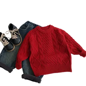 Kids chunky red cable knit sweater paired with denim jeans and black leather boots