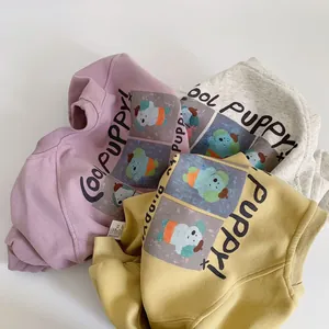Detail of round neck sweatshirts for kids featuring cute puppy print in three soft colors