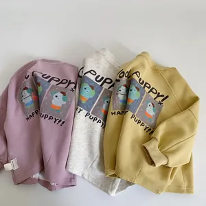 Detailed view of ribbed cuffs and cartoon puppy prints on three colorful cotton sweatshirts