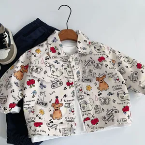 Macro detail of toddler cotton jacket with colorful cartoon graffiti and metal buttons