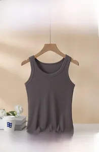 Macro detail of dark grey ribbed cotton camisole with built-in chest pad on a wooden hanger