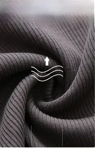 Macro shot of breathable grey ribbed cotton fabric showing soft texture and vertical patterns