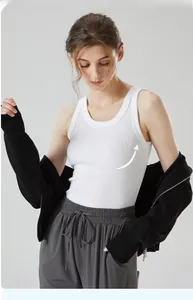 Close-up of white ribbed knit fabric texture on a slim-fit racerback tank top