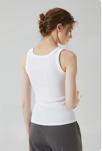 Detail view of the back design of a white ribbed cotton racerback tank top for women