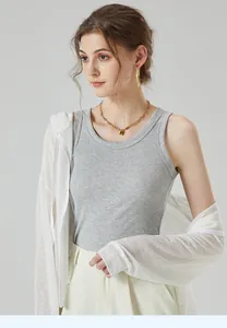 Detail of grey ribbed knit tank top with round neck and white zip hoodie styling