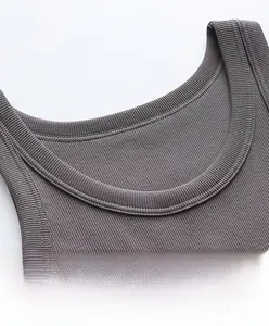 Macro shot of charcoal grey ribbed cotton vest showing double-stitched reinforced neckline