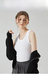 Detail of white ribbed tank top with black zip-up hoodie and dark grey sweatpants