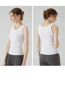 Detail of white ribbed cotton tank top showing high-quality knitted fabric texture and fit