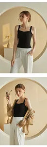 Fashionable black square neck tank top paired with white high waist trousers and sunglasses