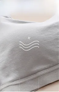 Close-up of light grey breathable cooling fabric with anti-pilling and moisture-wicking texture