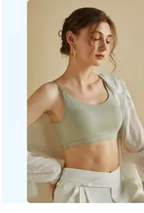 Close-up of light green seamless camisole with V-shaped back and thin straps
