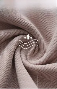 Macro detail of ribbed modal fabric showing breathable texture and soft purple finish