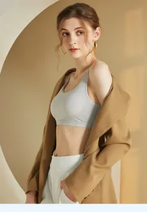 Detail of light gray cooling seamless bralette styled with a brown blazer jacket
