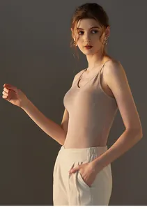 Detail of nude modal camisole with thin straps and V-neckline on a slim model