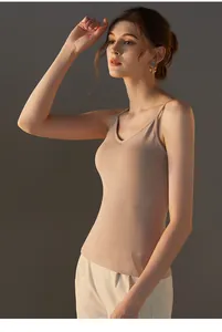 Detail view of skin-tone modal camisole with thin straps and a minimalist V-neck design