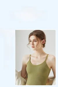 Detail of green ribbed V-neck crop top camisole with a close-up of knit texture