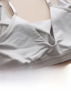 Detail of grey seamless sports bra featuring V-shaped back design and adjustable straps