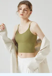 Detail of ribbed knit crop top in grass green with thin shoulder straps texture