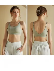 Detail of light green seamless camisole with thin straps and stylish V-back design