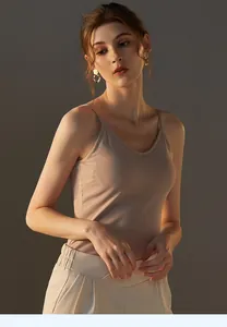 Close-up of beige ribbed modal camisole with thin straps and V-neckline texture