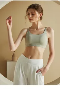Back view of light green seamless camisole with thin straps and V-shaped back design