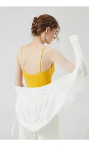 Detail of yellow camisole top with a lightweight white hooded sun protection jacket