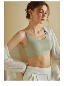 Detail of light green seamless sports bra with slim straps and cooling fabric texture