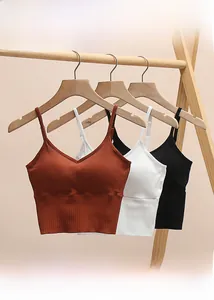 Detail showing adjustable straps and ribbed fabric texture of three V-neck crop tops