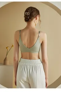 Deep V-back view of a light green seamless camisole with thin straps and cooling fabric