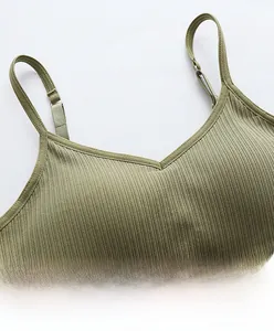 Detail of adjustable elastic shoulder straps on an olive green ribbed camisole top