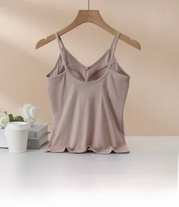 Detail view of the deep U-shaped back and thin straps on the modal camisole top
