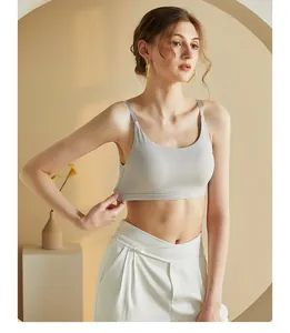 Close-up of light grey seamless tank top with thin straps and ribbed elastic hem