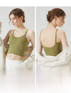 Detail view of olive green ribbed knit crop top with thin straps and V-neckline texture