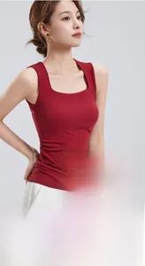 Detail of wide shoulder straps on dark red square neck tank top with built-in padding