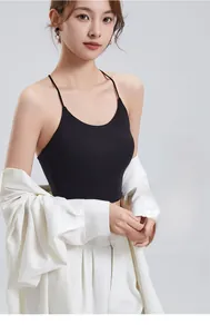 Close-up of black ribbed knit camisole with high-elastic fabric and built-in bra pads