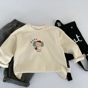 Detail view of cotton sweatshirt featuring a cute elephant print and a decorative crossbody bag