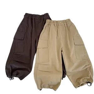 Boys cargo pants with elastic waist and adjustable drawstring cuffs in brown and khaki