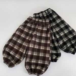 Kids plaid casual jogger pants with elastic waist in brown and black checkered patterns