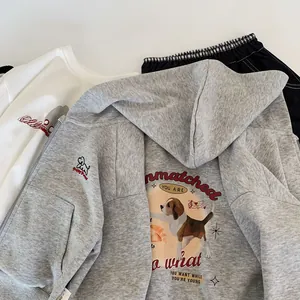 Detail of grey hooded zip-up sweatshirt featuring a vintage beagle puppy back print