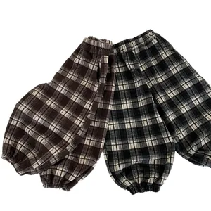 Kids plaid casual jogger pants with elastic waist and cuffed ankles in checkered pattern