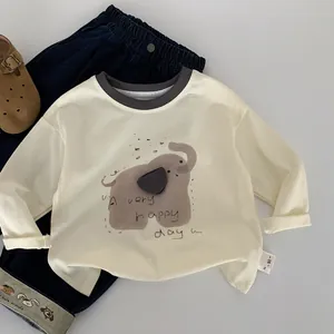 Close-up of kids cartoon elephant long sleeve shirt and denim pants with patch details