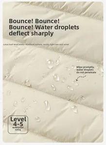 Macro shot of waterproof cream down jacket fabric showing water resistance levels 4-5
