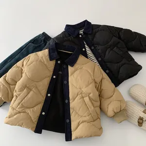 Detail of quilted kids jacket with corduroy collar and snap button closure