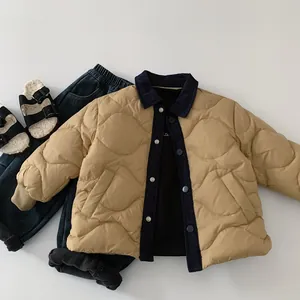 Flat lay of boys quilted down jacket with denim collar and matching winter outfit set