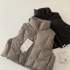 Gilet imbottito per bambini in nero e taupe con collo alto e chiusura lampo in metallo