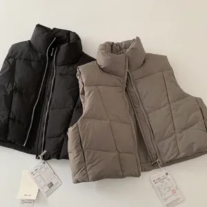 Gilet trapuntati per bambini in piumino d'anatra bianco nero e kaki con collo alto e zip
