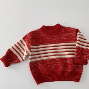 Detail of red and white striped knit sweater with ribbed cuffs and neckline for kids